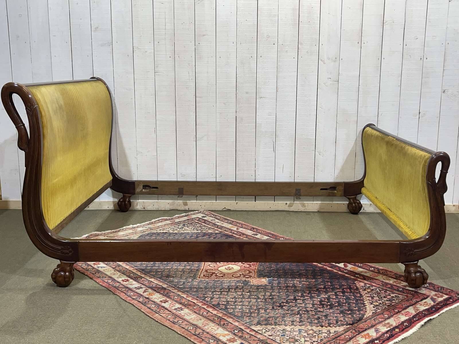 Early 19th century Empire mahogany bed with swan neck finials and claw feet