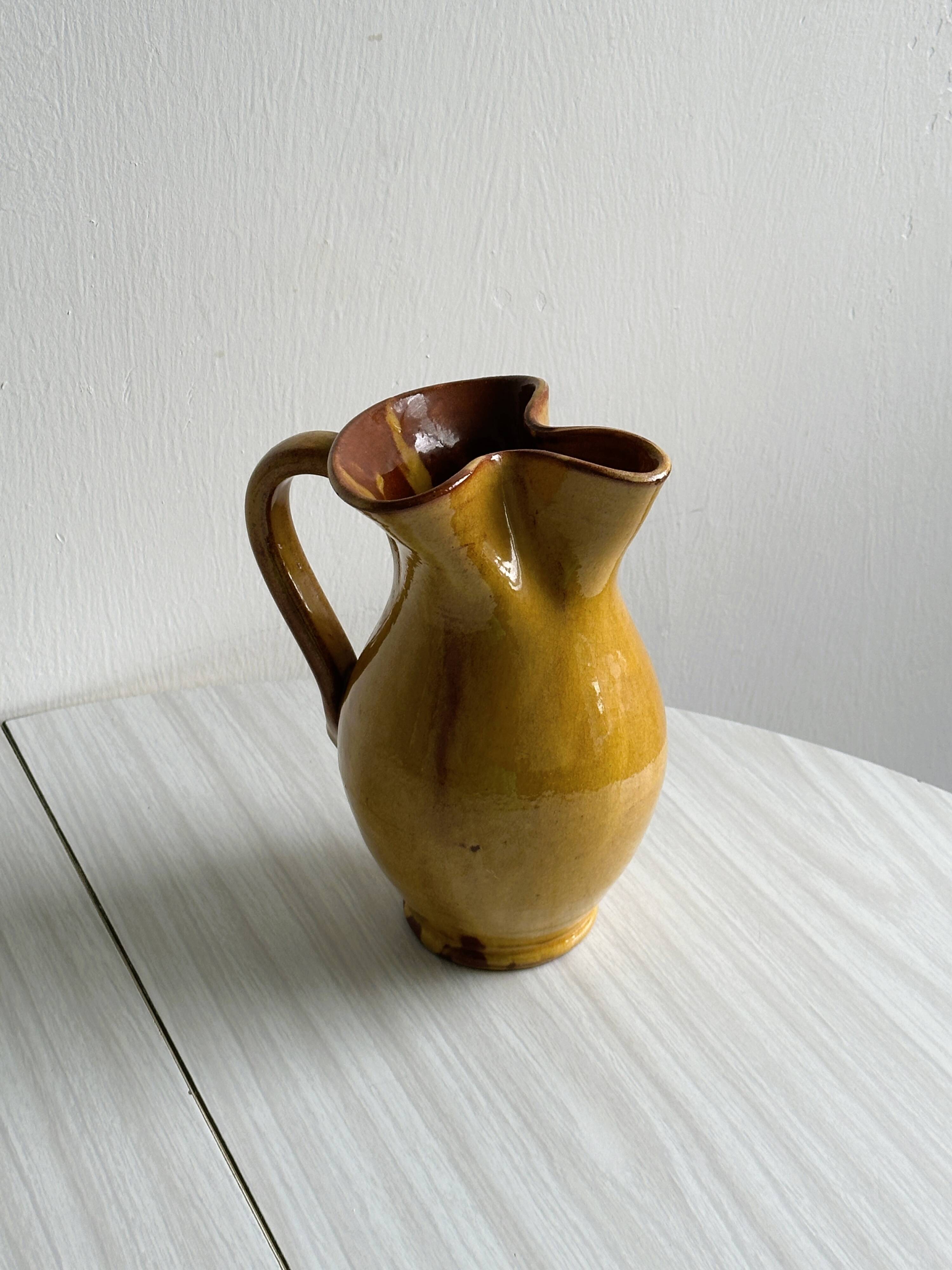 Vintage enameled ceramic pitcher - Retro mustard yellow jar.