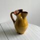 Vintage enameled ceramic pitcher - Retro mustard yellow jar.