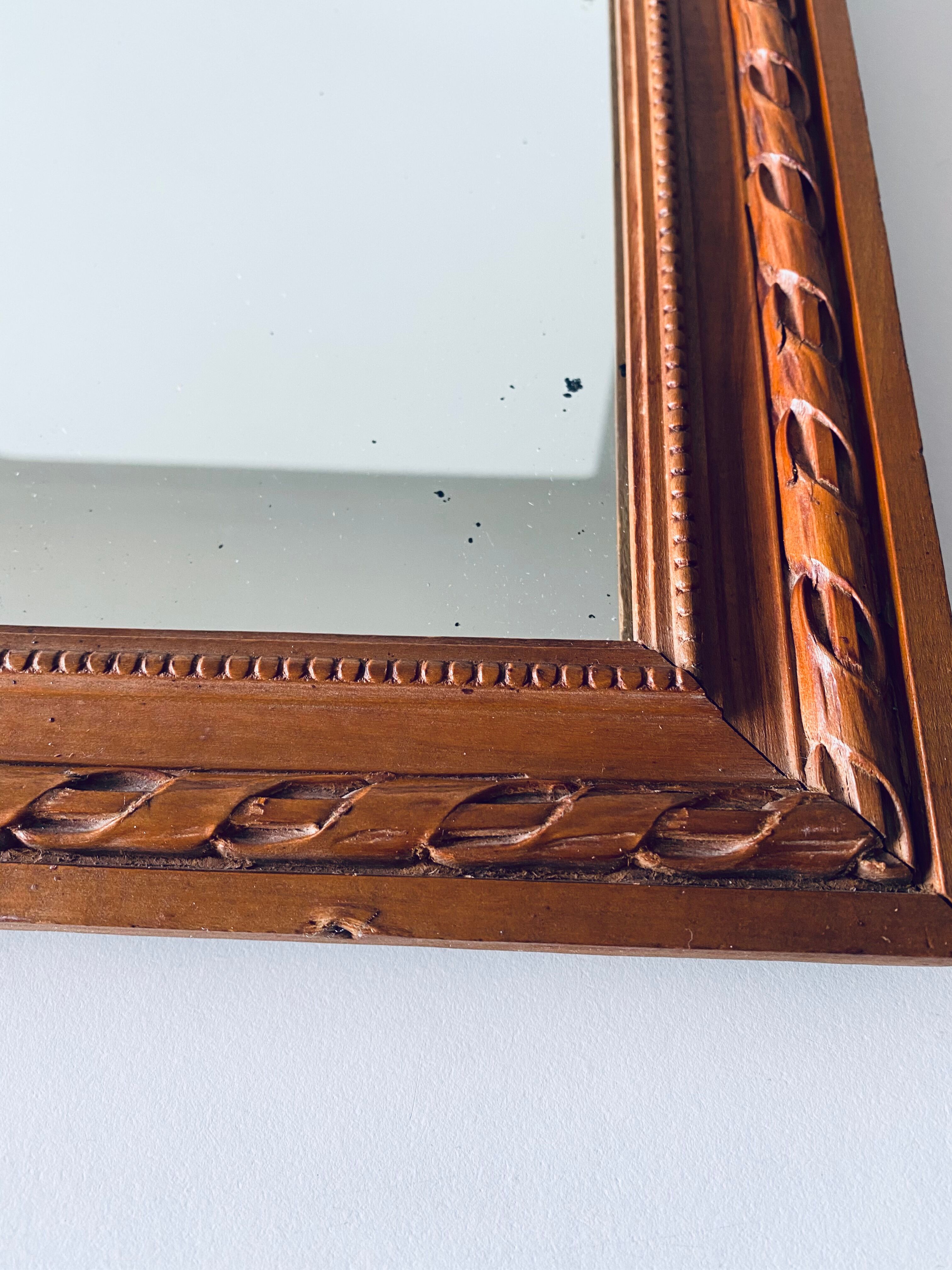 Antique mirror in carved wood and mercury 48x63cm