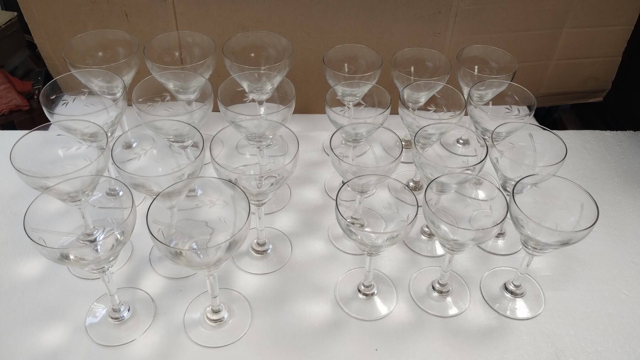 set of 23 champagne glasses or wine glasses in chiseled crystal.