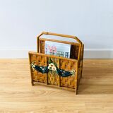 Vintage rattan magazine holder with floral decoration