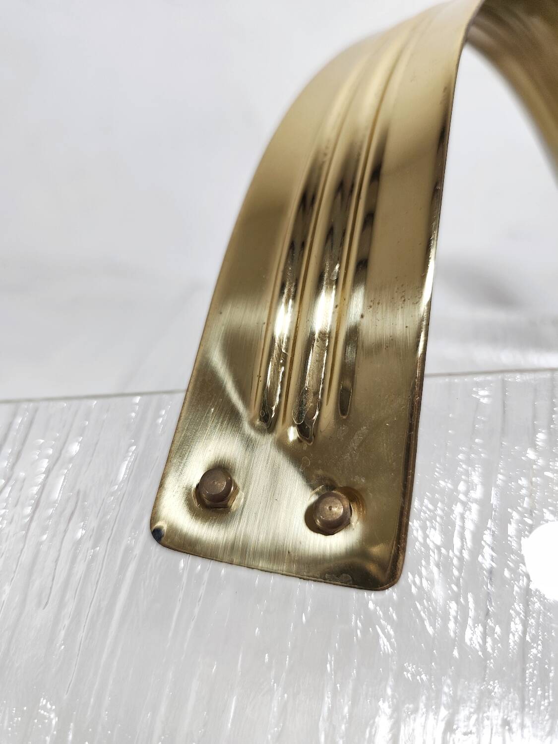 Revistero de metacrilato y latón. España, 1980s.