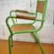 Metal and wood school chair with armrest