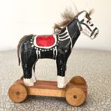 Old wooden pull-along toy, horse.
