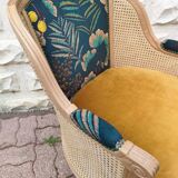 Cane and velvet armchair