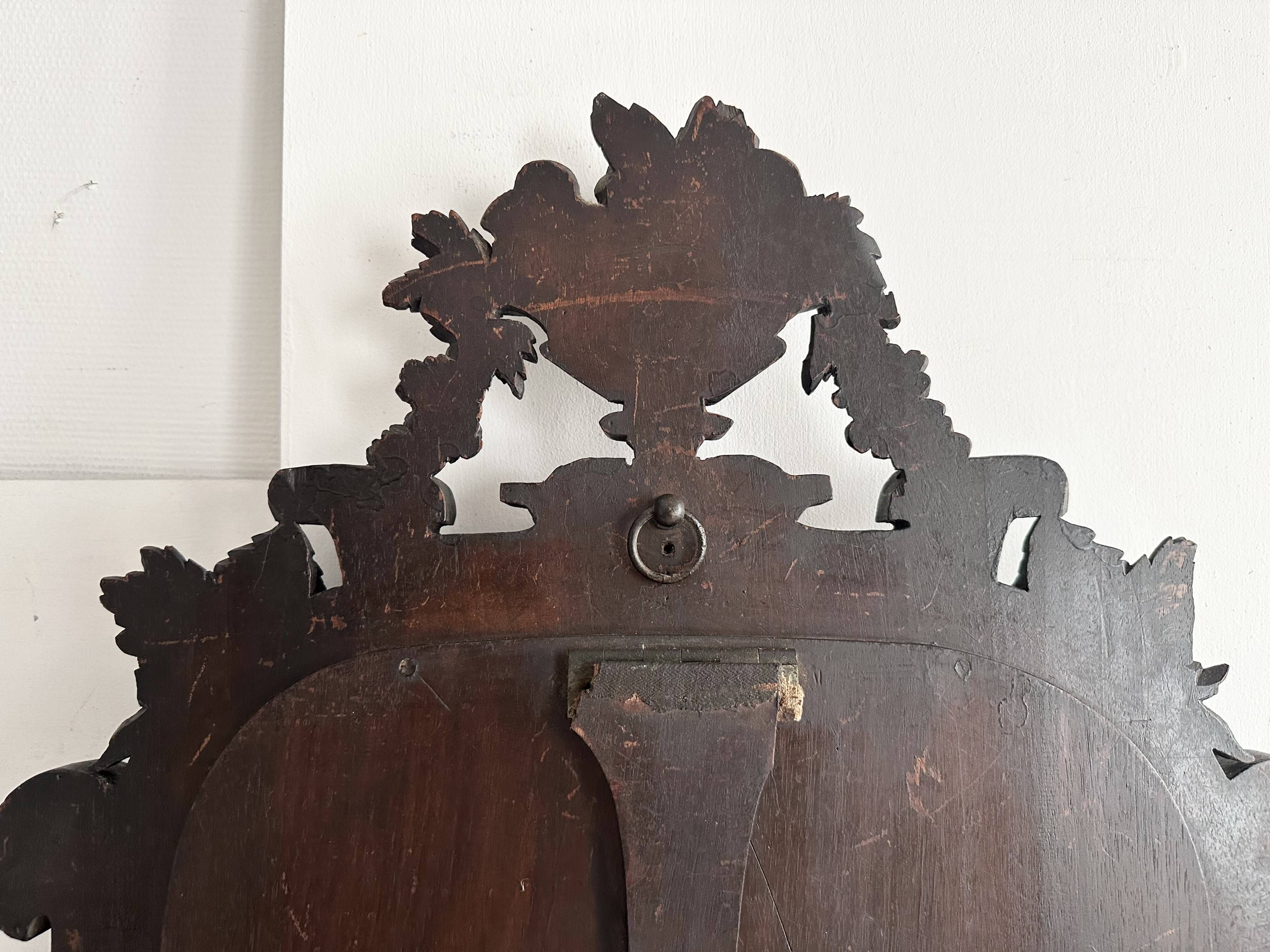 Napoleon III mirror in carved blackened wood, 19th century