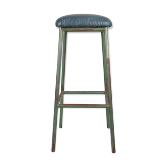 Workshop in green leatherette-covered sitting metal high stool