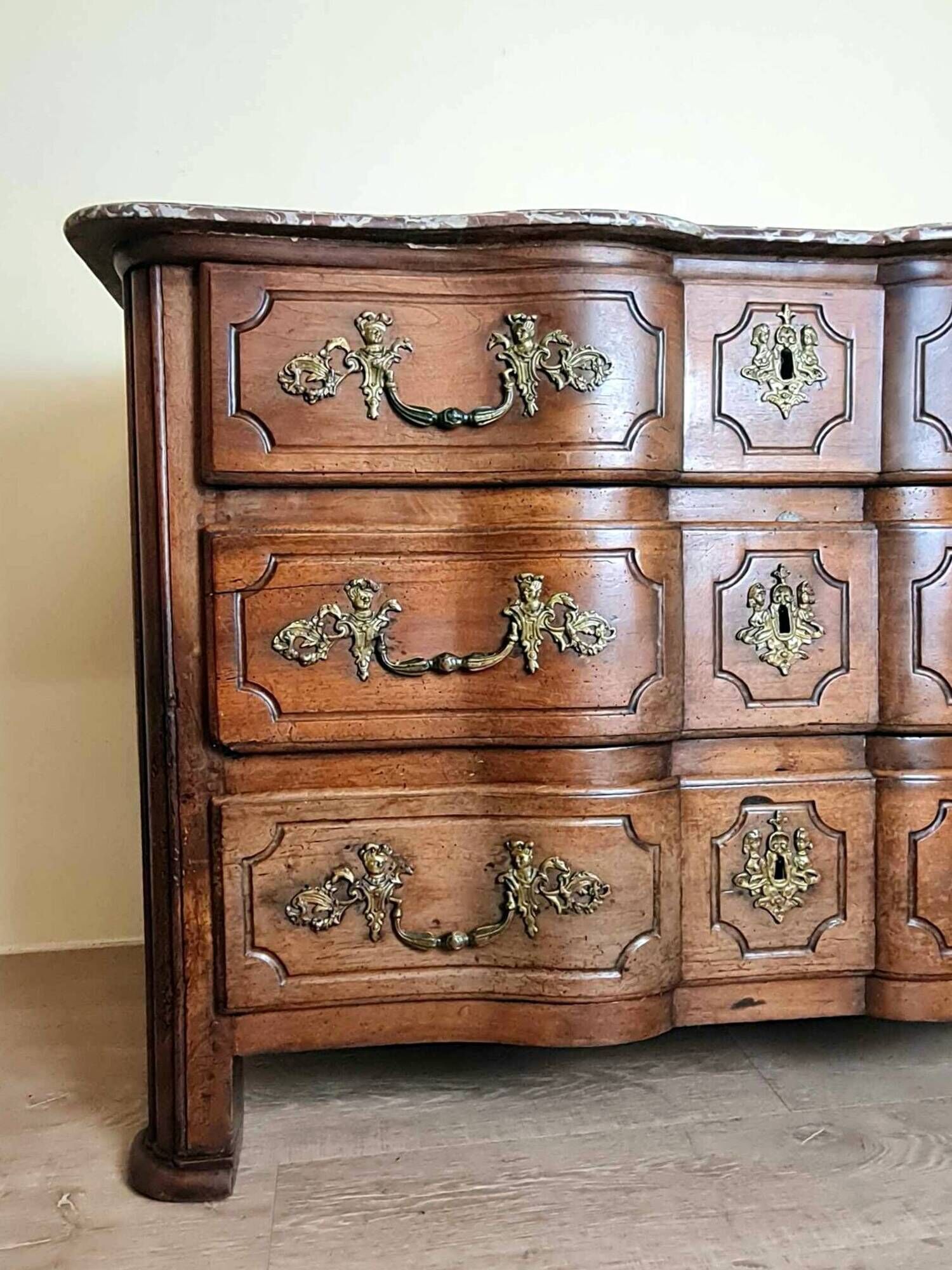 Louis XIV period Arbalette chest of drawers in solid walnut circa 1700