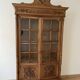 Antique wooden library with a carved pediment.