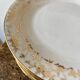 Set of 9 dessert plates in white and gold porcelain
