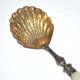 Empire sprinkling spoon in gilded silver vermeil and mother-of-pearl, 19th century.