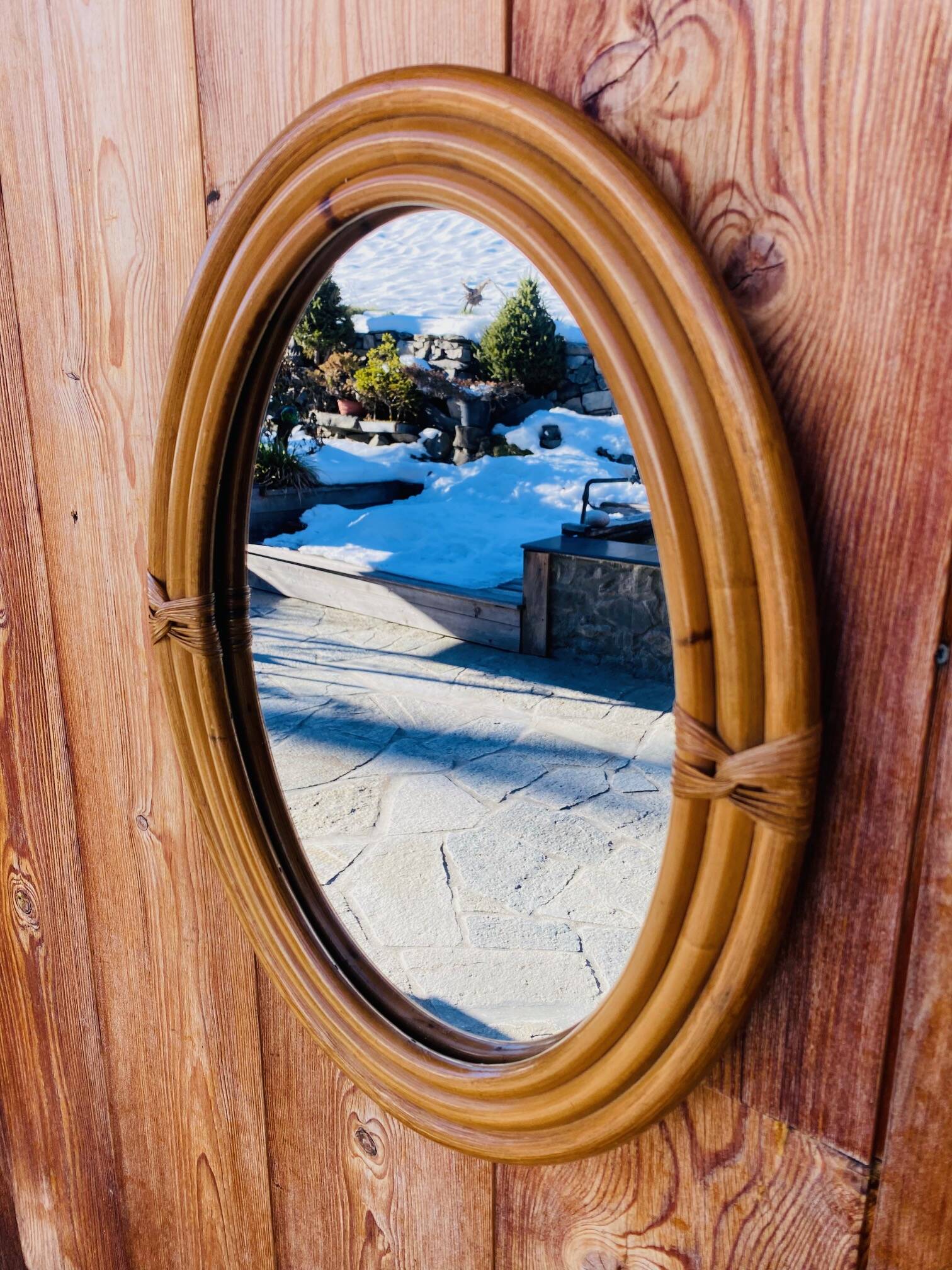 Vintage oval rattan mirror