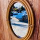 Vintage oval rattan mirror