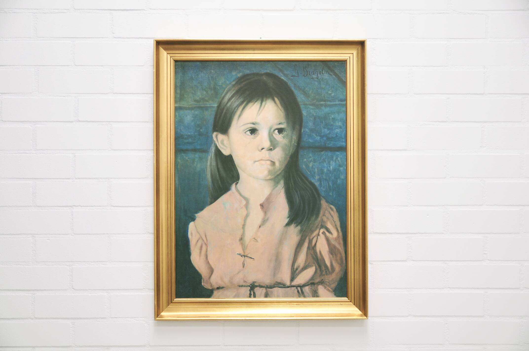vintage gold frame with portrait of crying girl by Bragolin
