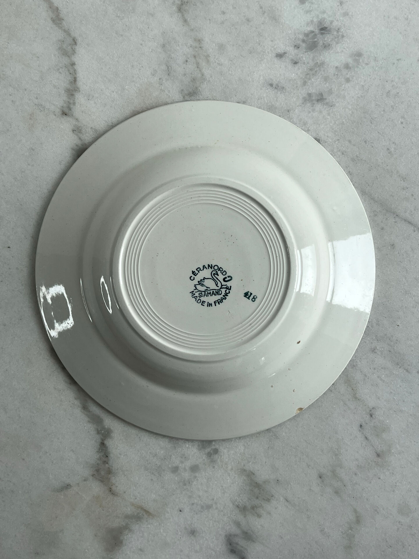 Set of 3 St Amand deep plates with green crown decoration.
