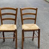 2 solid wood and straw chairs