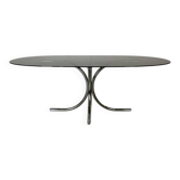 Vintage coffee table from the 70s in smoked glass and chrome, oval, Space Age style.