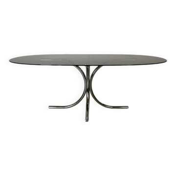 Vintage coffee table from the 70s in smoked glass and chrome, oval, Space Age style.