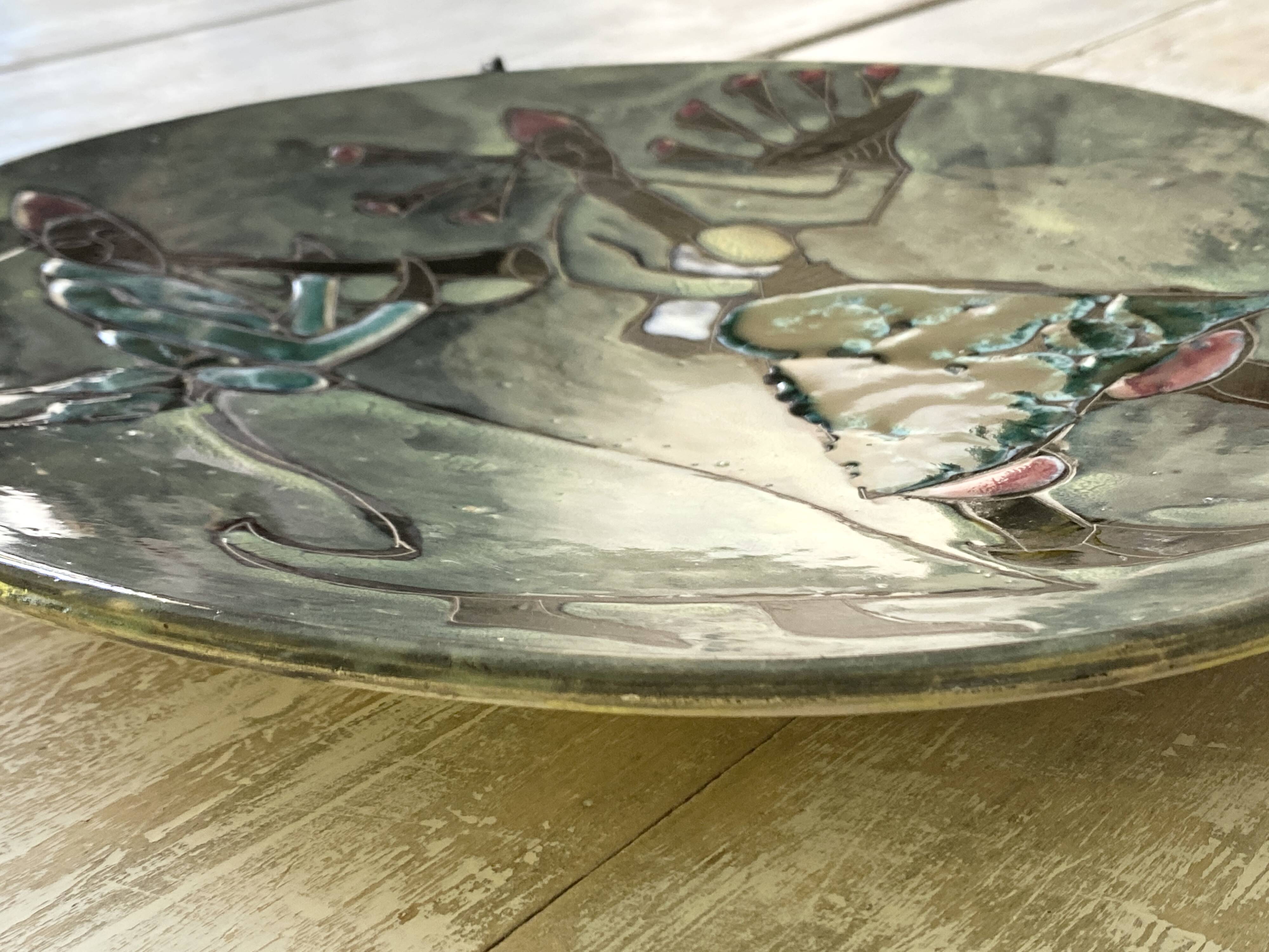 Musicians ceramic dish, signed