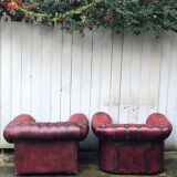 Pair of red leather chesterfield chairs