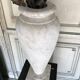 Pair of carrara marble vases, bronze bouquet of flowers