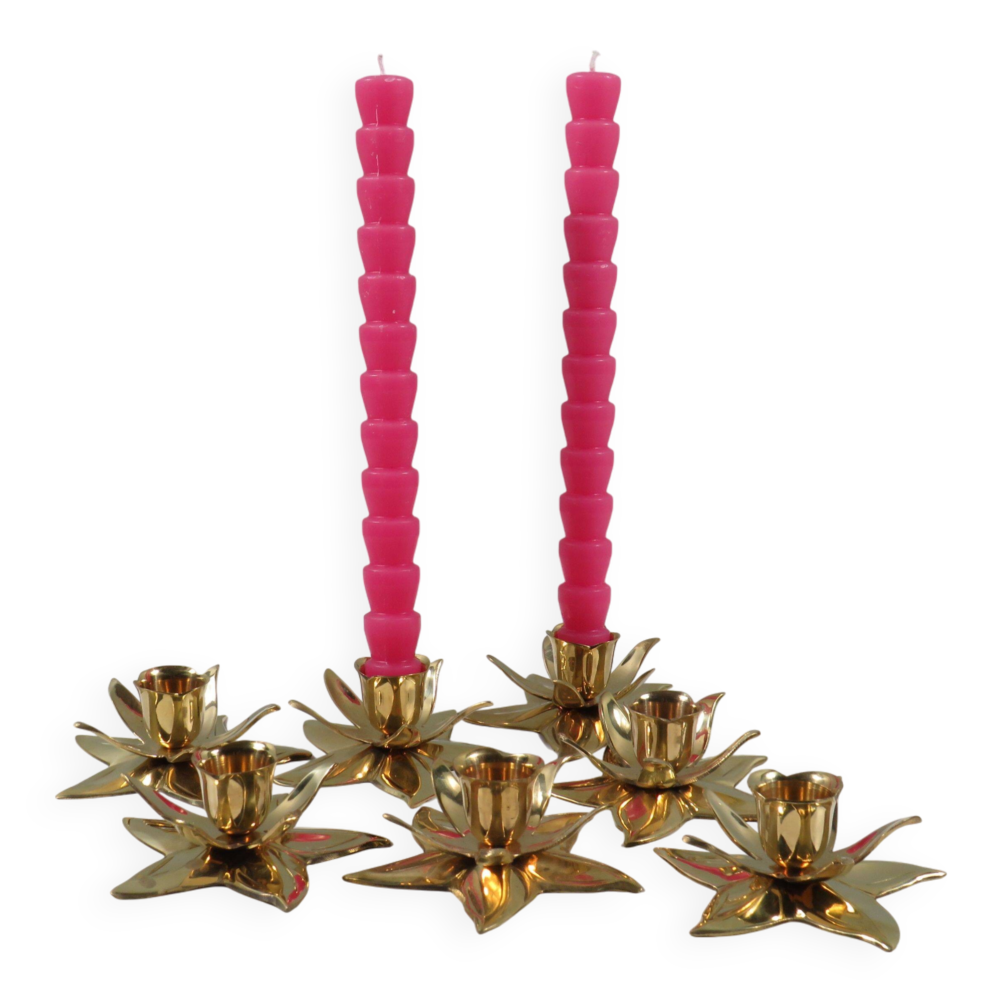 Set of 7 heavy shiny brass flower shaped candle holders, 1970-1980