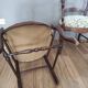 Pair of Provençal armchairs in brown wood and floral fabric.