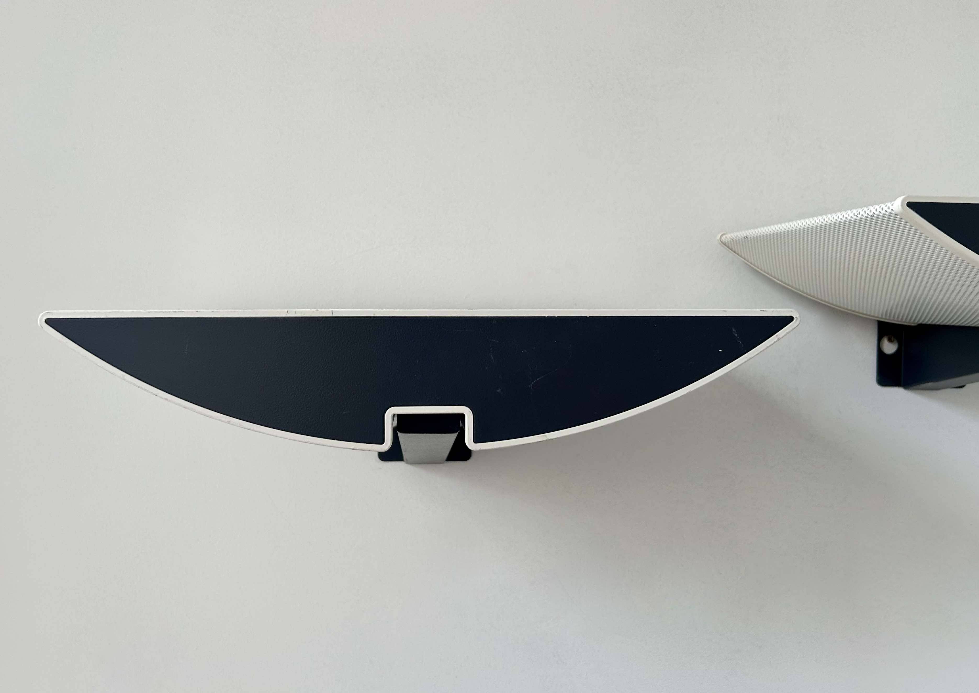 Pair of modernist wall lights, black and white lacquered metal, Italy 1980