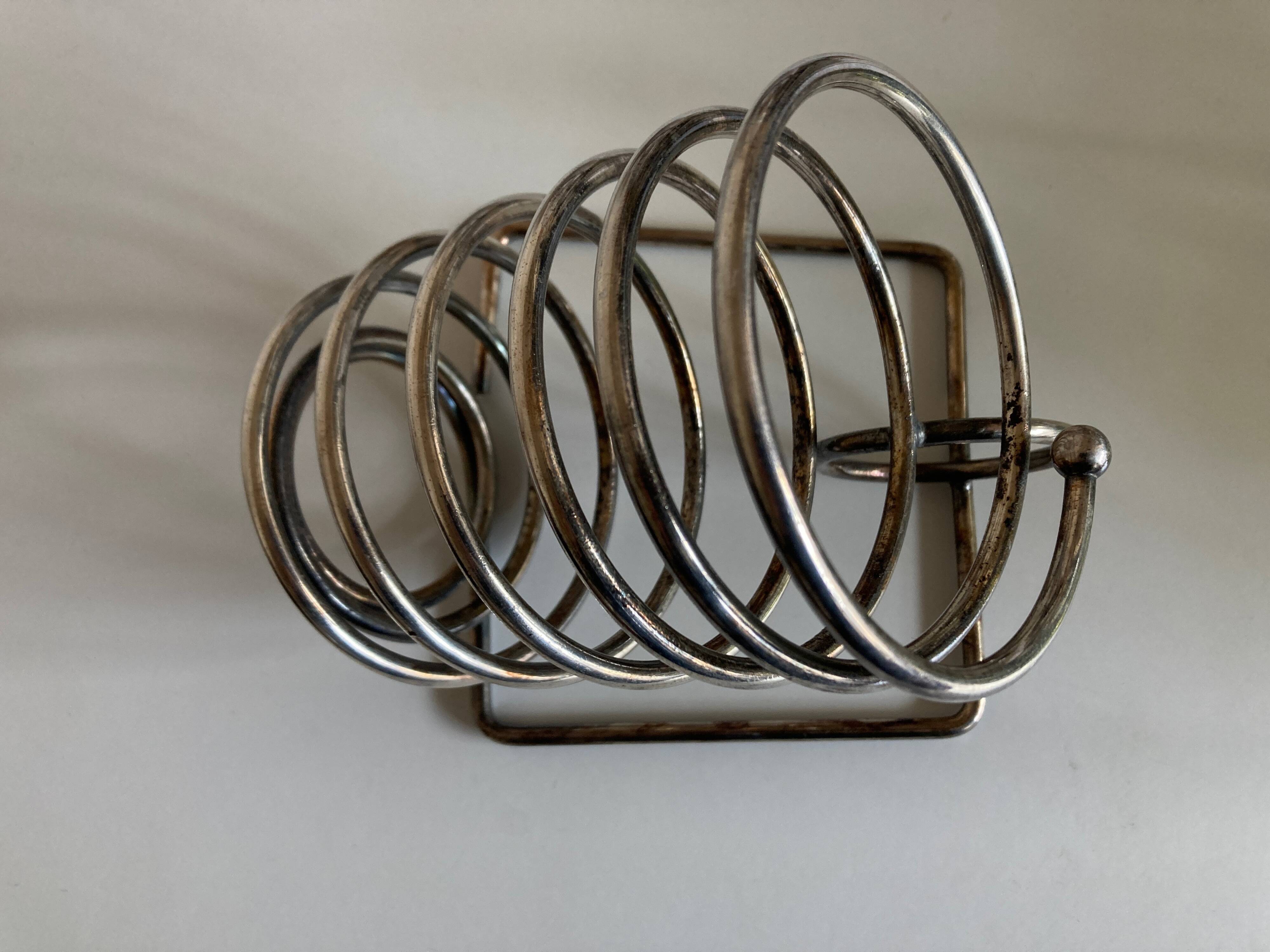 Spring bottle holder in silver metal 1970