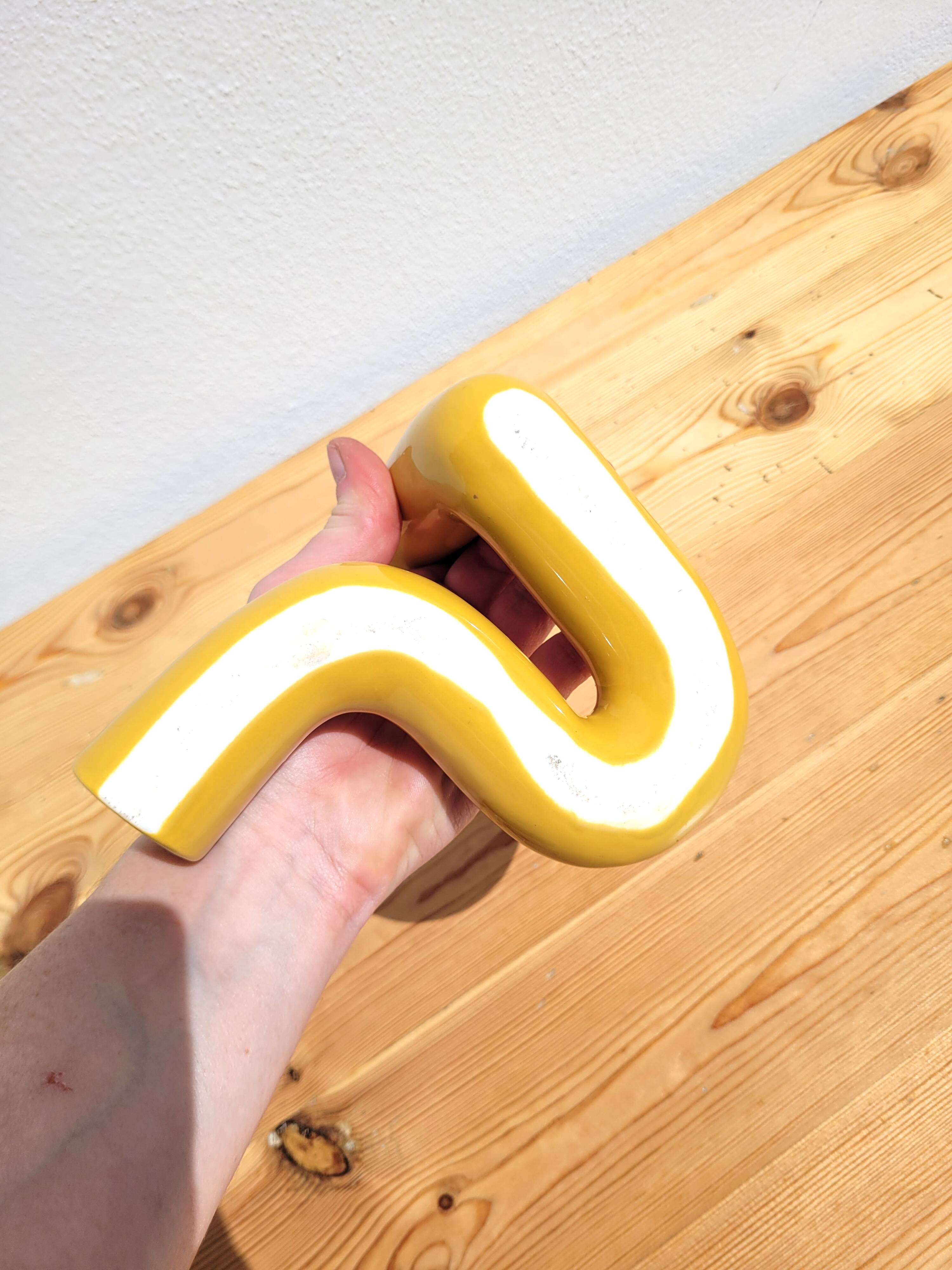 Yellow ceramic twist candle holder