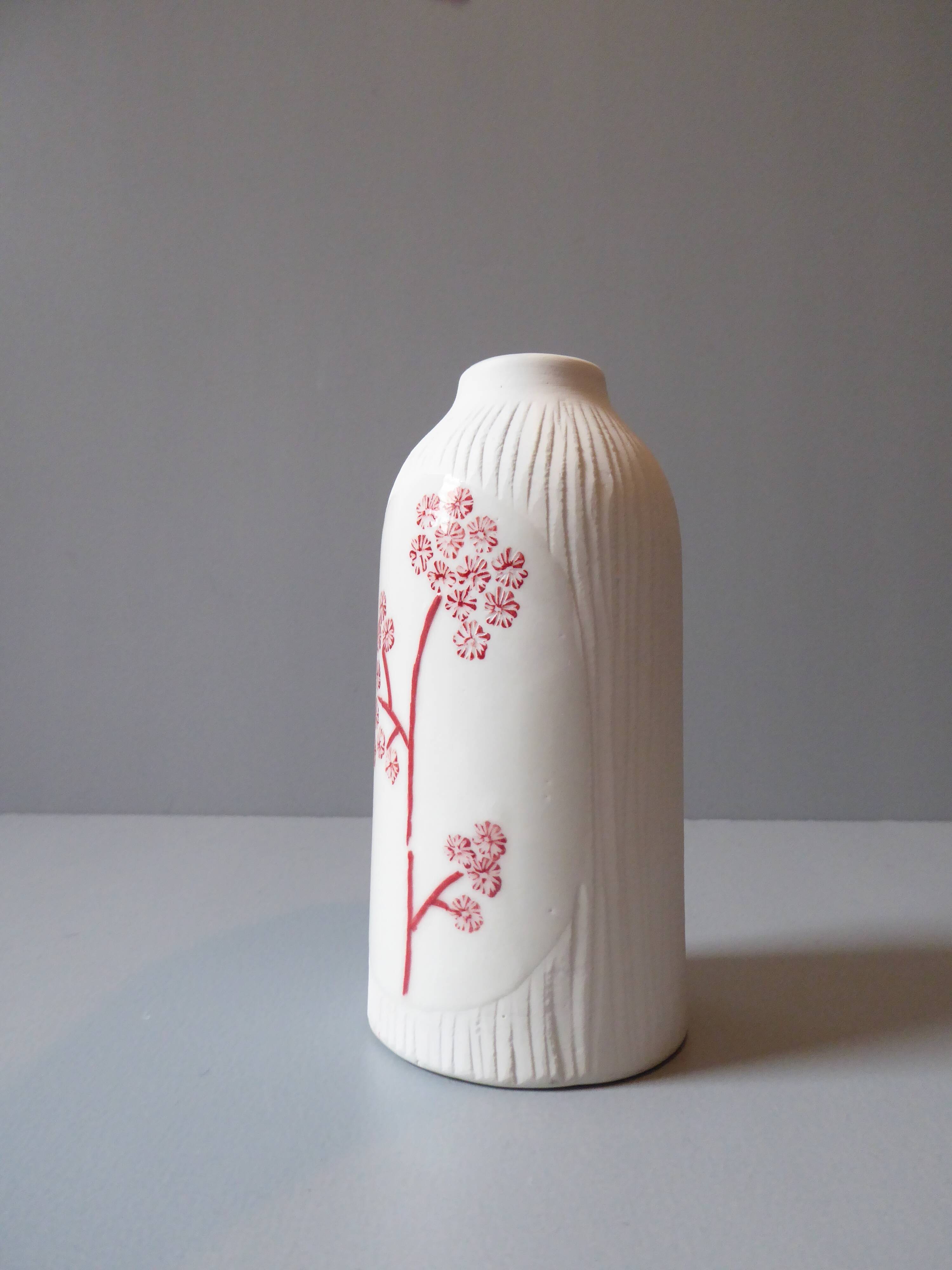Porcelain vase and biscuit decorated with flowers
