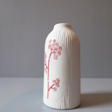 Porcelain vase and biscuit decorated with flowers