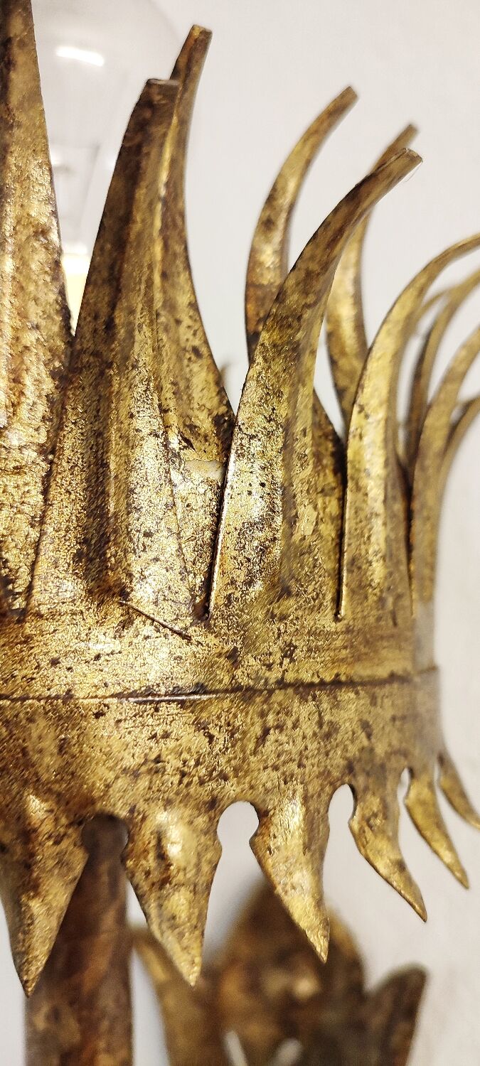 Wrought iron and gold leaf wall light. Spain, 1950s.