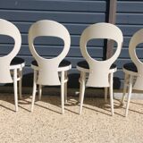 6 baumann chairs, white gull with black faux leather.