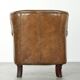 Robust cowhide armchair in a beautifully subtle size with a wonderful patina.