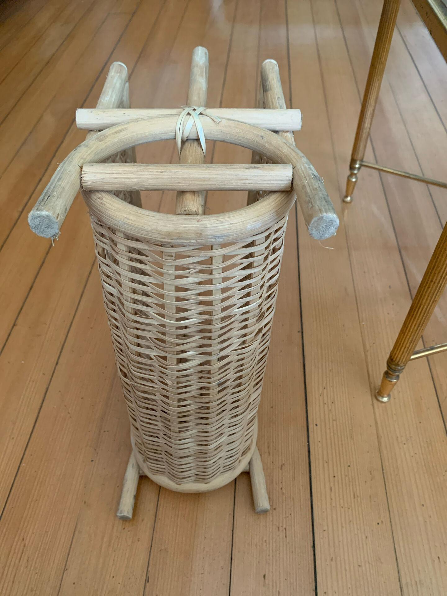 Vintage magazine rack in woven rattan and bamboo.