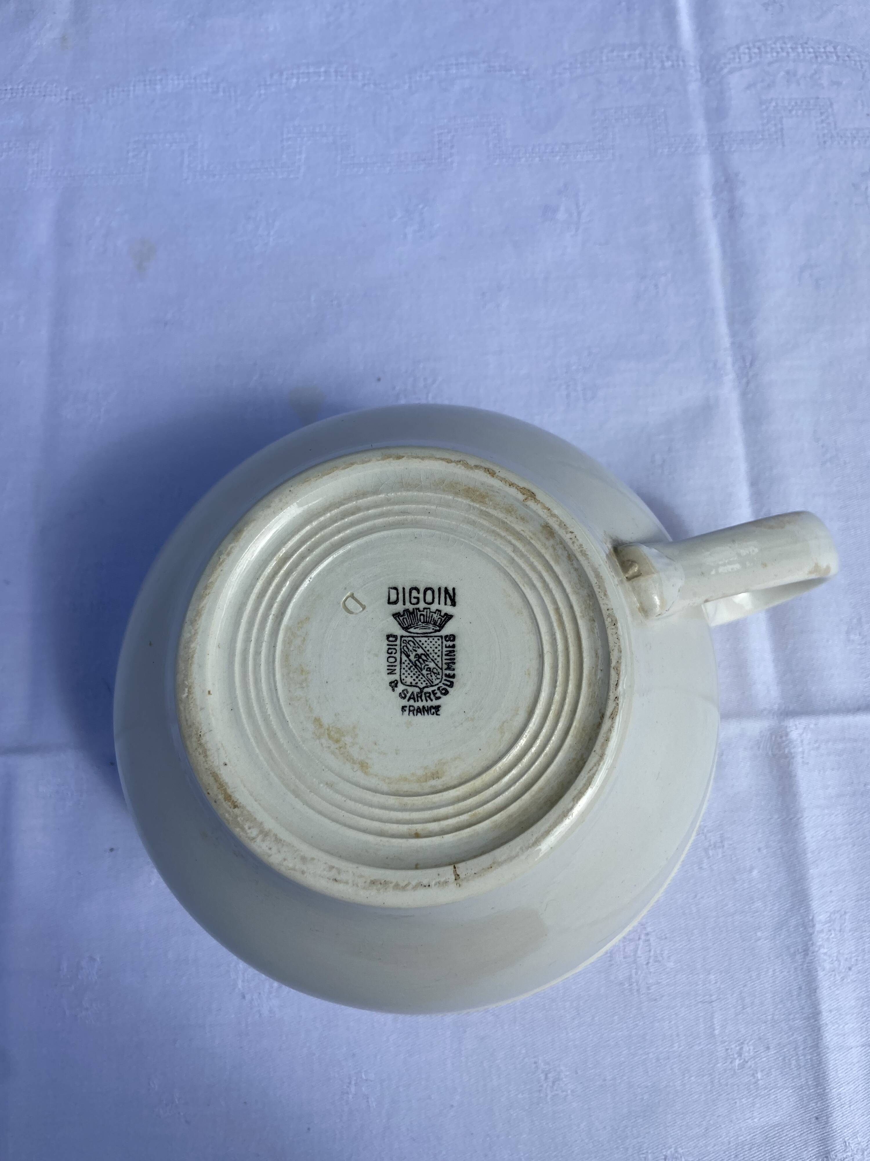 Old Digoin chamber pot in white earthenware – repurposed as a dice bowl.