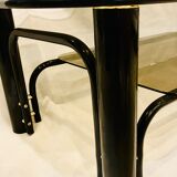 Black and gold coffee table with double tops in smoked glass circa 1970