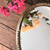 Gilded oval mirror, foliage pattern