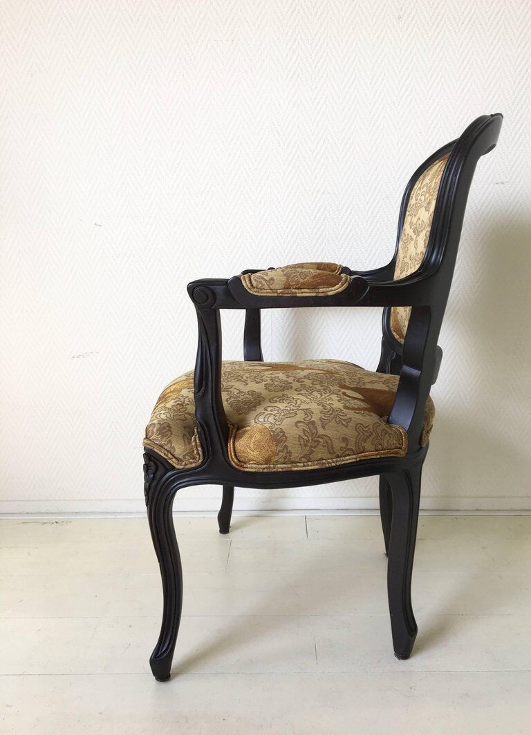 Black baroque armchair with fabric designed by wildlife by Ascension Latorre, Spain