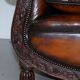 Two-seater canapé in aged leather, Victorian style.