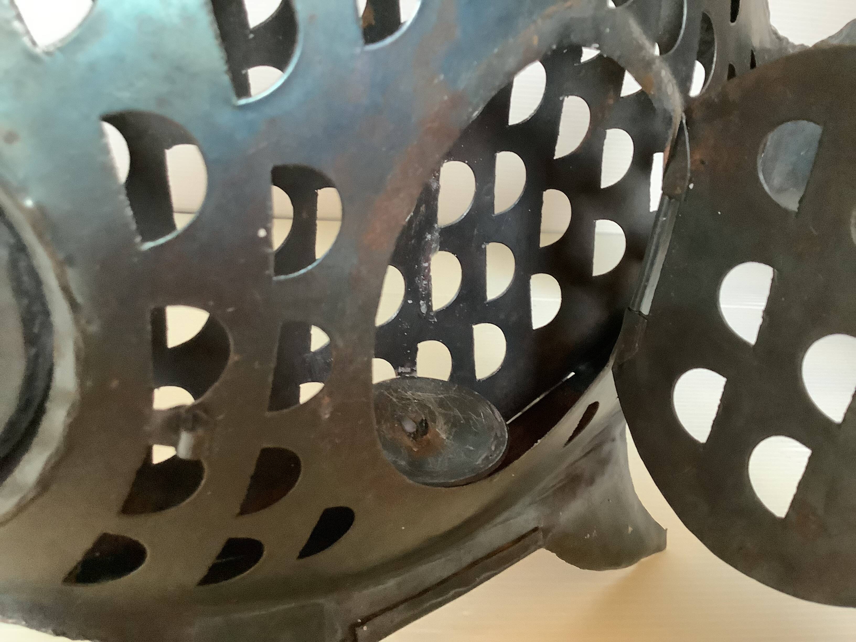 Large metal fish-shaped candle holder
