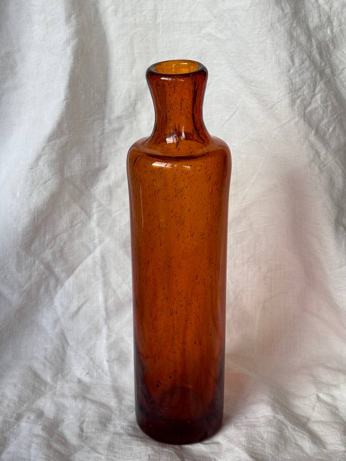 Biot blown glass bottle