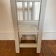 Small children's chair in antique white wood.