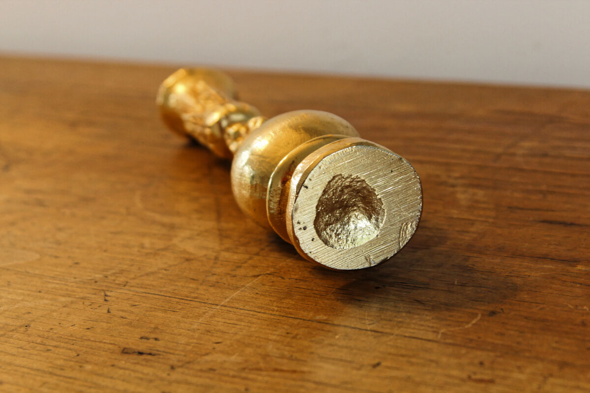 Pair of handmade candle holders, cast iron