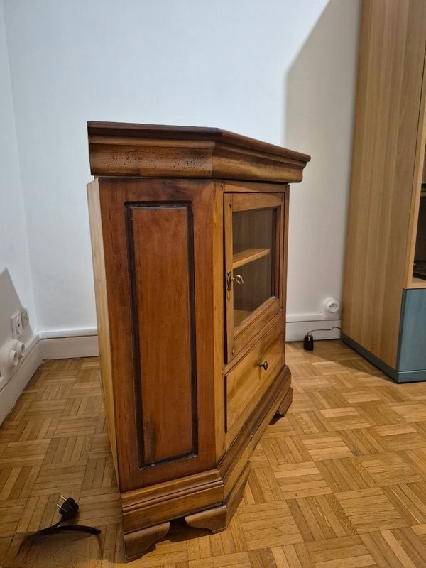 Wooden TV unit with a rotating top.