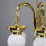 1930s Czechoslovak Art Deco brass chandelier with five opaline glass globes