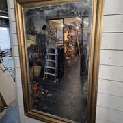 Golden mirror in oak from the 19th century.
