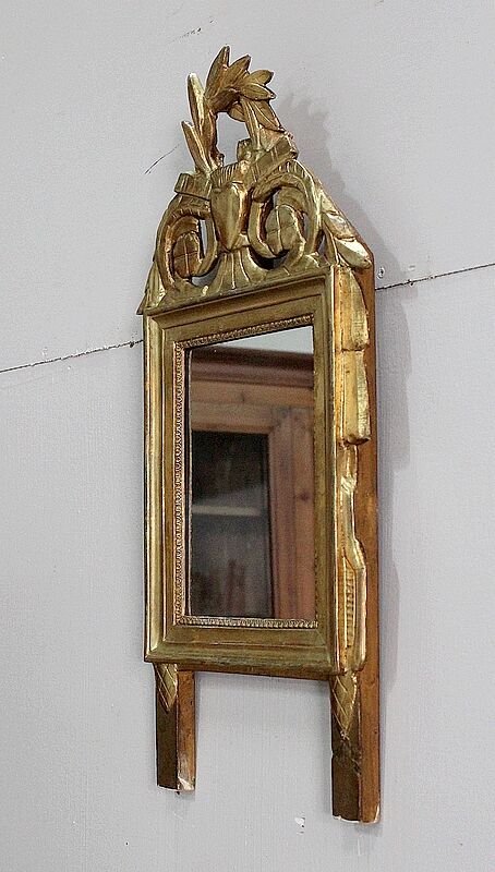 Miroir en bois doré, style Louis XVl, début XXe